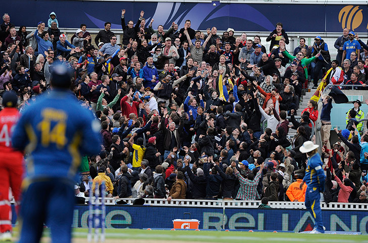 Champions Trophy 2: The crowd reach up to catch a six from Bopara in the final over