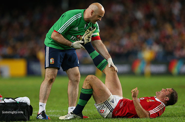 Lions Tour Match: Jamie Roberts of the Lions receives attention after injuring himself