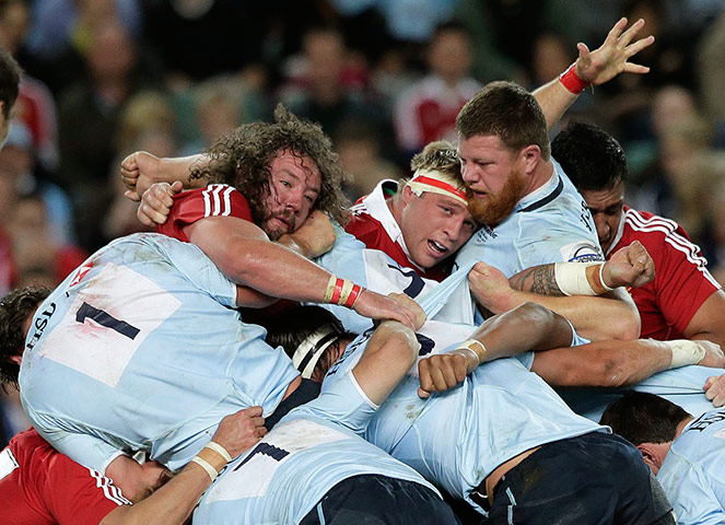 Lions Tour Match: Lions player Adam Jones and Tom Youngs hit a wall of Waratahs