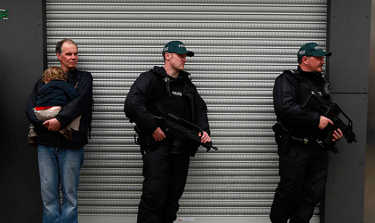 G8: Armed police officers patrol during the anti-G8 demonstration in Belfast