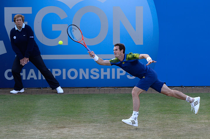 Tsonga v Murray: Andy Murray stretches to make a return