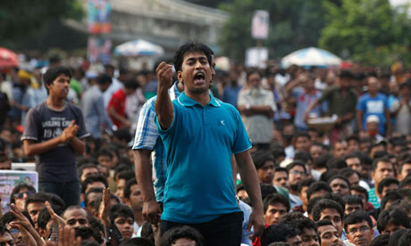 A demonstratrr shouts slogans during a rally in Dhaka