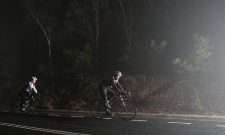 The Leader of the Opposition Tony Abbott rides through a Canberra fog early this morning. The Global Mail.