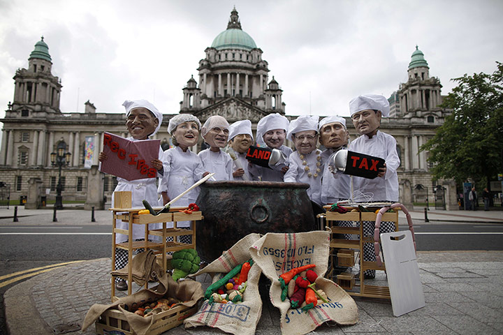 Big IF at G8: Oxfam charity volunteers wear masks depi
