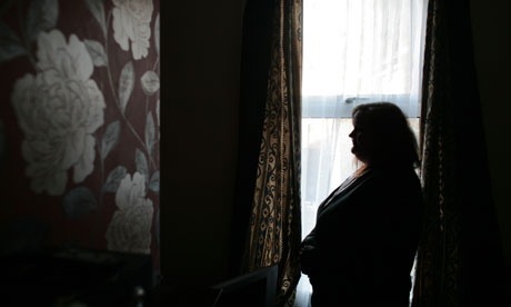 Silouette of a woman by a window