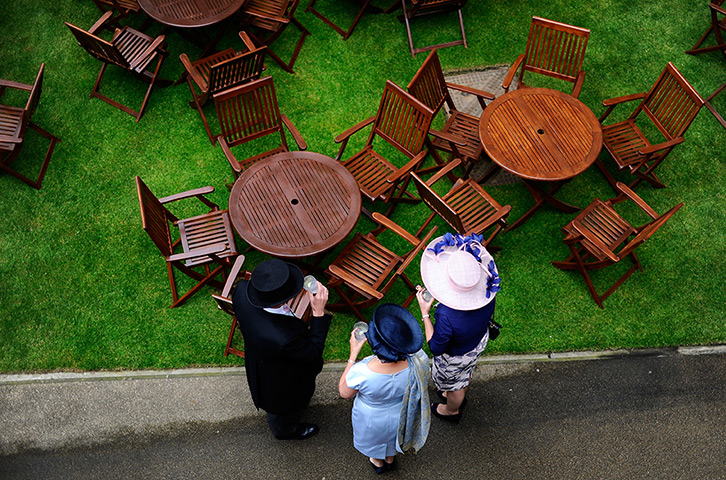 Ascot day one: Racegoers enjoy a drink outside the grandstand 