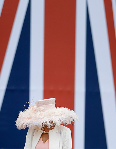 Ascot day one: Kay Ceille looks down to view her phone as she walks through the public enc