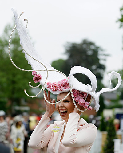 Ascot day one: Anneka Tanaka-Svenska laughs a she holds onto her hat