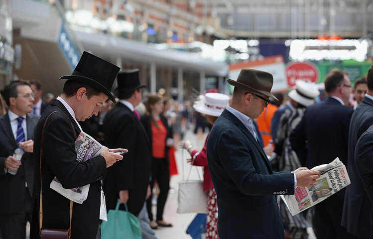 Ascot day one:: Racegoers wait at Waterloo station