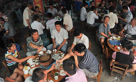 Chinese diners tuck into dog-meat hotpot in a restaurant in Yulin, Guangxi province