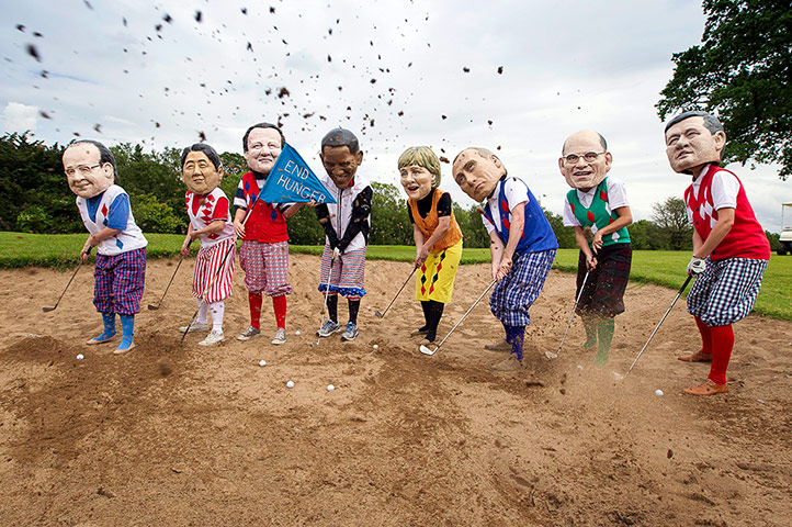 Big IF at G8: Anti-G8 protesters disguised as G8 leaders playing a round of golf 