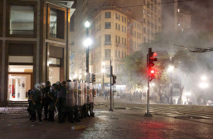 Brazil protests continue: Riot police huddle in Sao Paulo