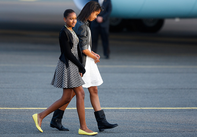 Malia and Sasha Obama: Sasha and Malia Obama walk to their car at the Tegel airport in Berlin on d
