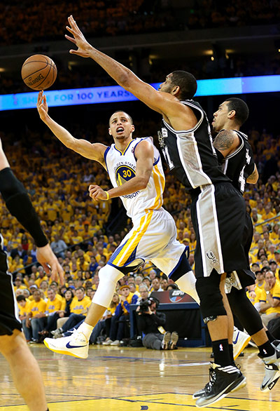 NBA Championship: Stephen Curry of the Golden State Warriors shoots against Tim Duncan