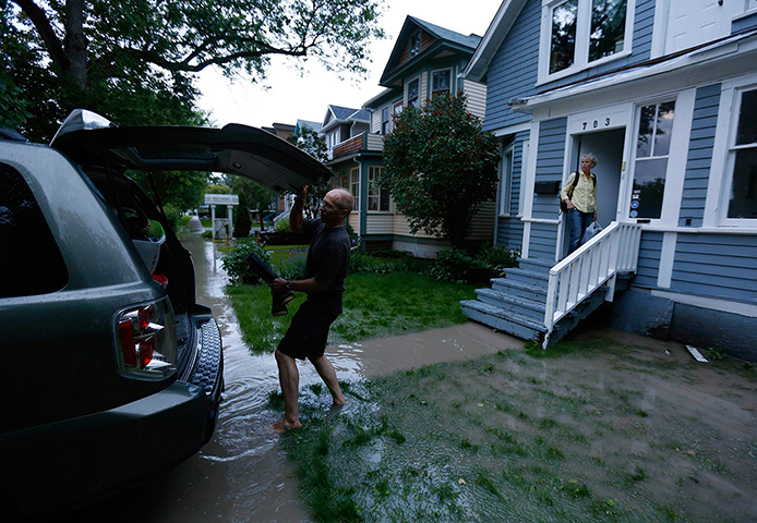 Canada floods: Mike Bradfield and Debra evacuate their home in the neighborhood of Sunnysi