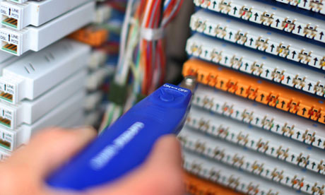 An engineer works on a fibre-optic network