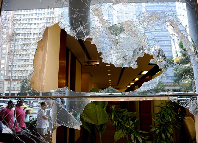 Brazil Protests: Office windows smashed during overnight protests in Rio de Janeiro
