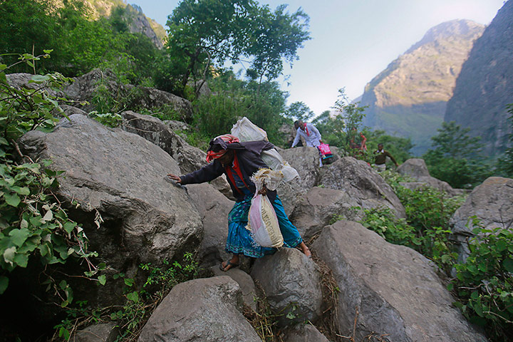 India Food: A woman carrying her belongings in cement sacks