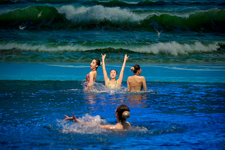 weekend in pictures: North Korean women perform synchronized swimming at a dolphin show facility