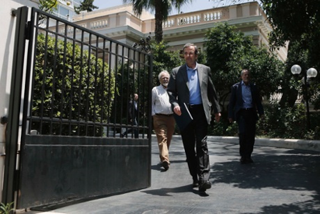 Greece's Prime Minister's Antonis Samaras leaving his office in Athens June 24, 2013