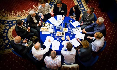 People gathered around a table at the Local Government Leaders Quarterly in Leeeds