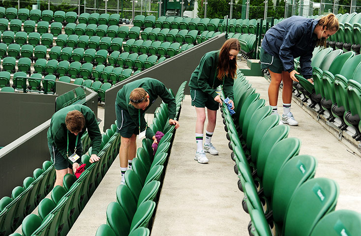 Wimbledon day one: Cleaning seats