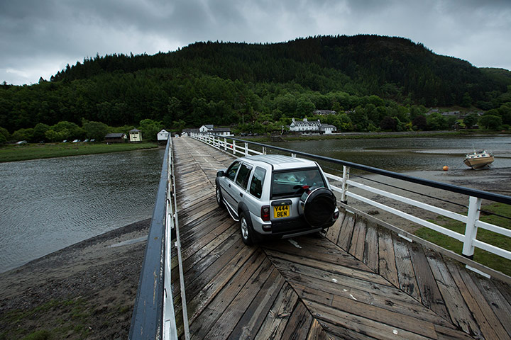 Penmaenpool Bridge: A car crosses Penmaenpool Bridge