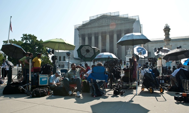 Television news crews gather in front of the US supreme court in Washington as justices delivered their ruling on the Voting Rights Act.