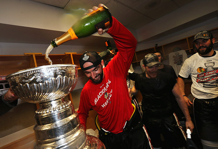 Stanley Cup final: Michal Rozsival celebrates with the Stanley Cup in the locker room
