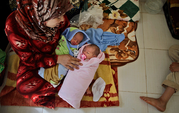 Syrian refugees: Fatimah Abdullah at her twins at a refuge point in Turkey