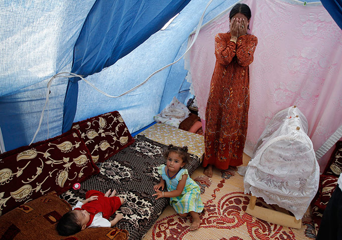 Syrian refugees: Members of a Syrian refugees family at the Domiz refugee camp