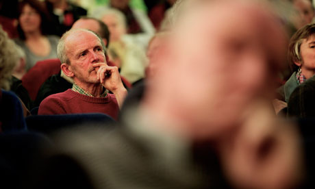 Man listening at a meeting