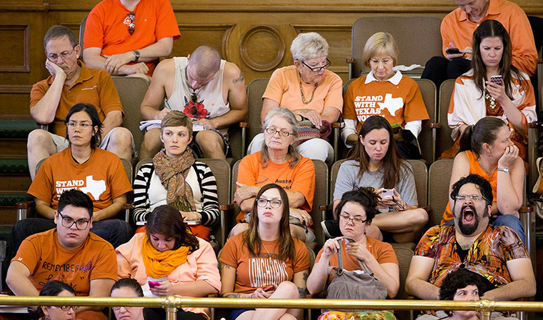 A pro-choice activist yawns during Texas senator Wendy Davis's filibuster of an abortion bill