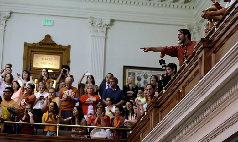 Members of the public try to stall proceedings after Wendy Davis's filibuster was cut off 15 minutes short