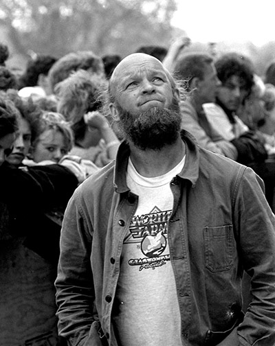 Glastonbury 80s: Michael Eavis gazes upwards by Pyramid