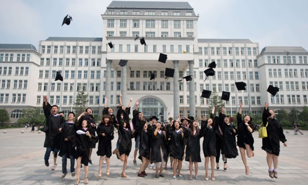 School's out for summer: Students throw their hats in the air following their graduation ceremony at the private Kade College Capital Normal University on the outskirts of Beijing. Despite a boom in student numbers in recent years, many graduates will face considerable employment uncertainty.