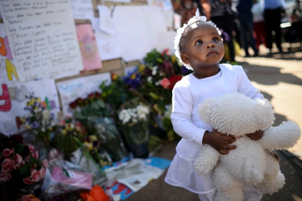A little child and her teddy join the many well-wishers outside the Medi-Clinic Heart Hospital where ailing former South African President Nelson Mandela is being treated in Pretoria.