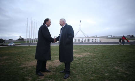 Bruce Hawker and Senator Doug Cameron on the lawns outside Parliament House, Canberra. The Global Mail.