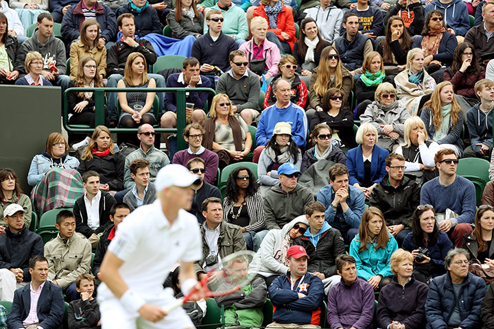Sleepers at Wimbledon: A woman leans on her partner