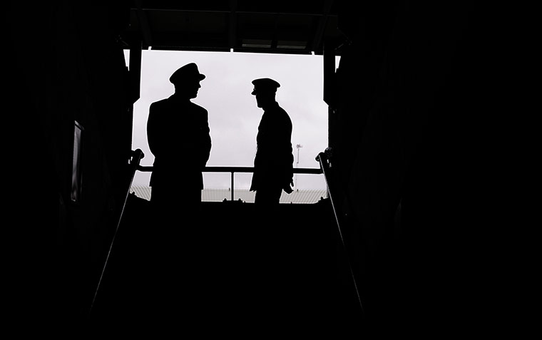 tom wimbo day 5: The stewards on Court One take shelter whilst waiting for the rain to stop 