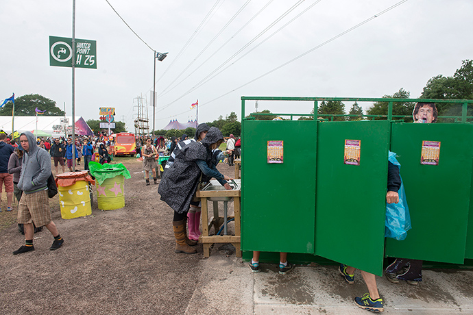 Stones cutouts: Mick's not too famous to use a portable toilet
