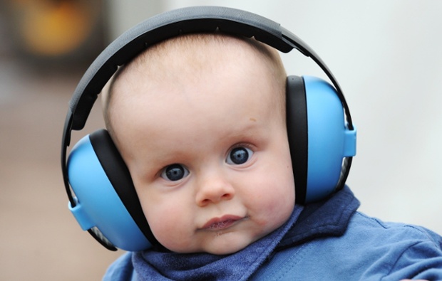 This lad is getting into music at an early age: though six-month old Henry Gilbert probably can't hear a peep through those ear defenders.