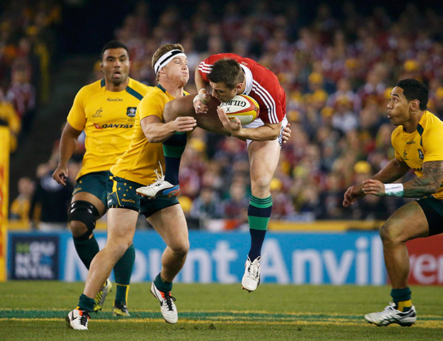 Lions: Michael Hooper tackles Tommy Bowe 