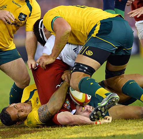 lions gallery 3: British and Irish Lions winger George North (red) is driven into the ground