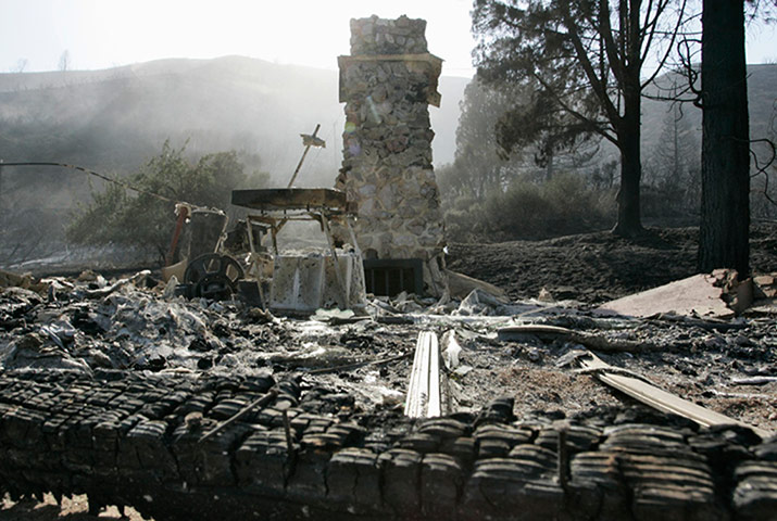 wildfire: A chimney stands amid burned rubble