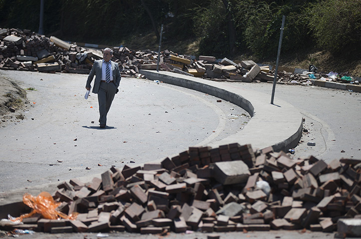 Turkey protests: A man walks past makeshift barricades