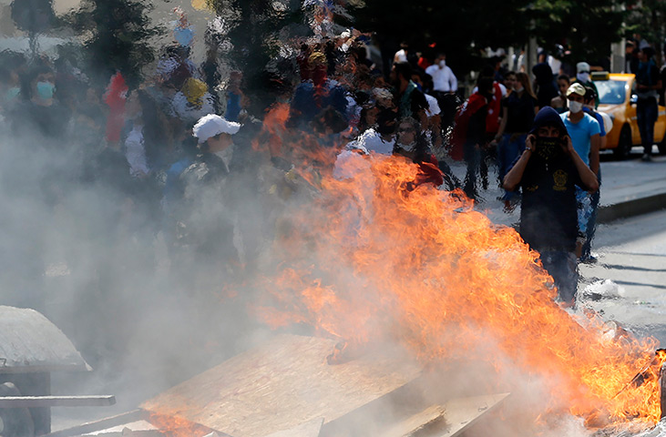 Turkey protests: Protesters gather behind a barricade in Ankara 