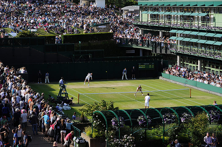 tom wimbo day 6: Jonny Marray serves during his mixed doubles match with Heather Watson