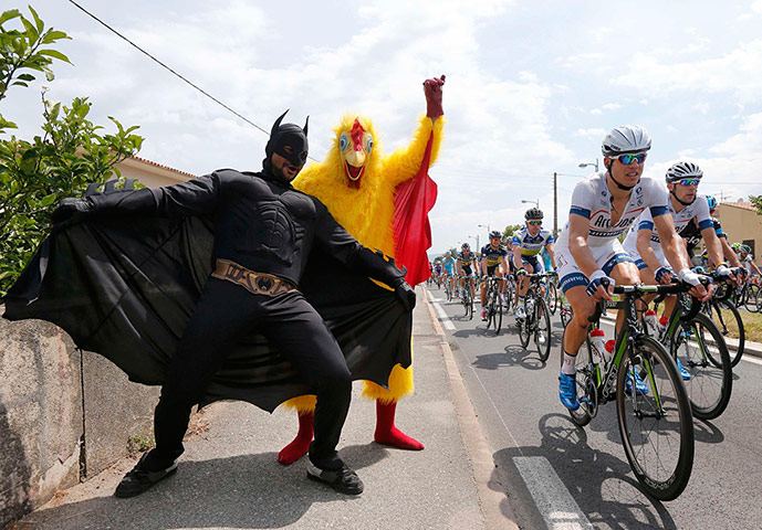 TDF: Fans dressed in costumes cheer on the pack of riders 