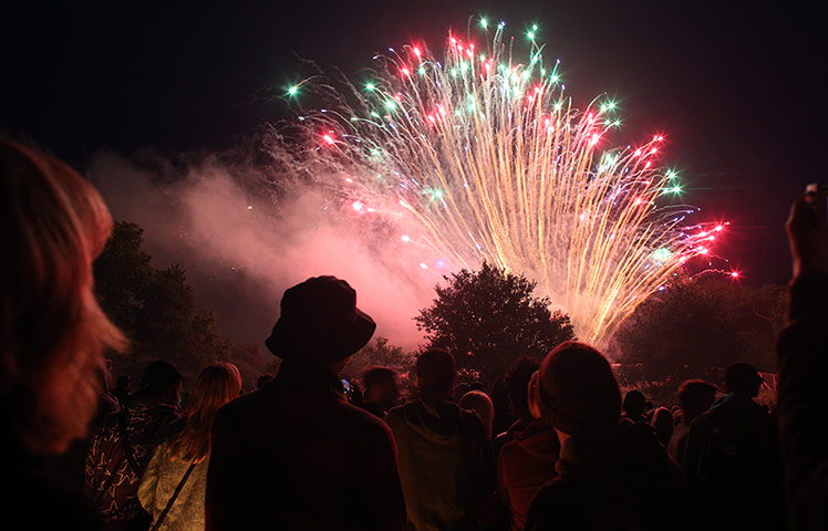 nightlife: People gather to watch the fireworks display launched above the stone circl